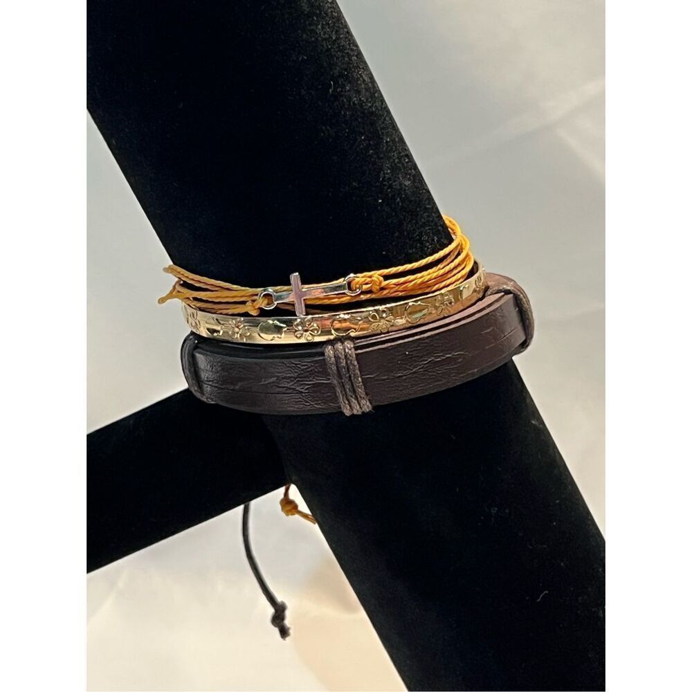 Three Stackable Bracelets One Brown Leather Adjustable, One Yellow String Adjust